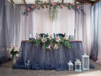Spring wedding table decor with flowers and lanterns