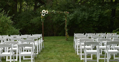Wedding ceremony arch with flowers in a garden