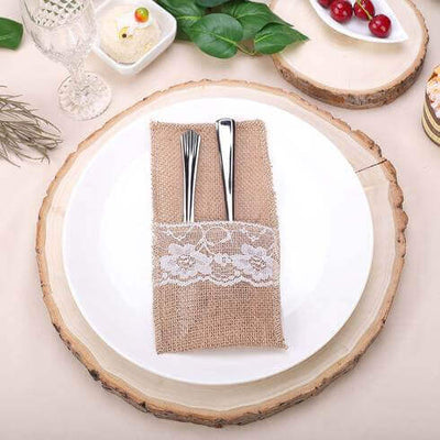 Burlap napkin holder on a wood slice charger