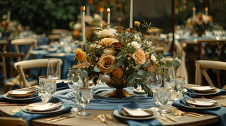 Elegant round table decor ideas with blue linens, a floral centerpiece, and candlelight for a sophisticated outdoor event.