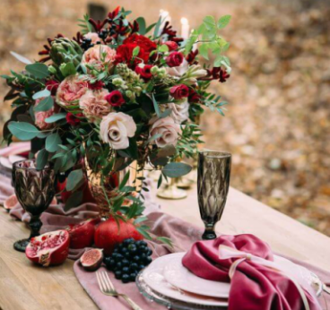 White floral arrangement on a wooden slab