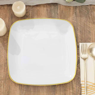 White square plate with a golden rim on a wooden table.