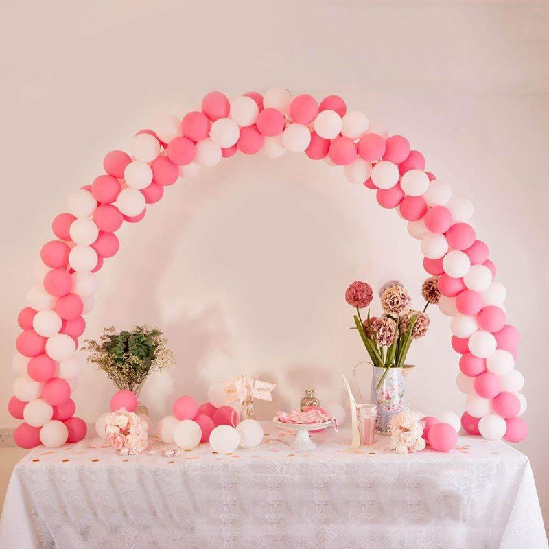 Pink and white balloon arch backdrop