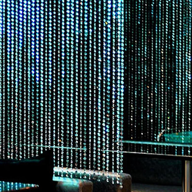 Blue beaded curtain in a dark interior