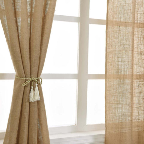 Natural burlap curtains tied back at a window