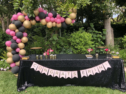 Black sequined table with silver runner and balloon decor