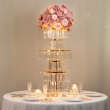 Elegant floral centerpiece with lights on a dining table setting.
