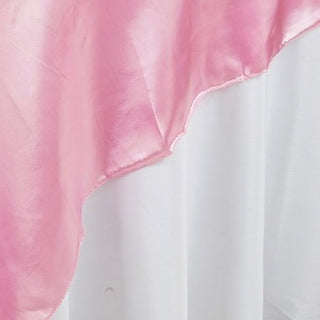 Enhance Your Event Decor with the 90"x90" Pink Seamless Satin Square Table Overlay