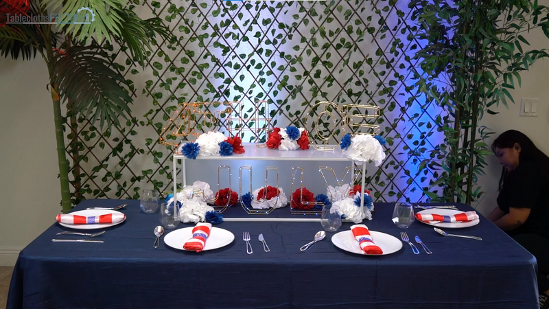 Woman assembling the spotlight behind the table