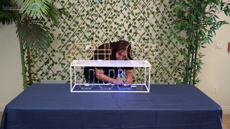Woman adding string lights to the 3D centerpiece