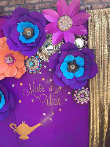 Purple Make a Wish backdrop with large paper flowers