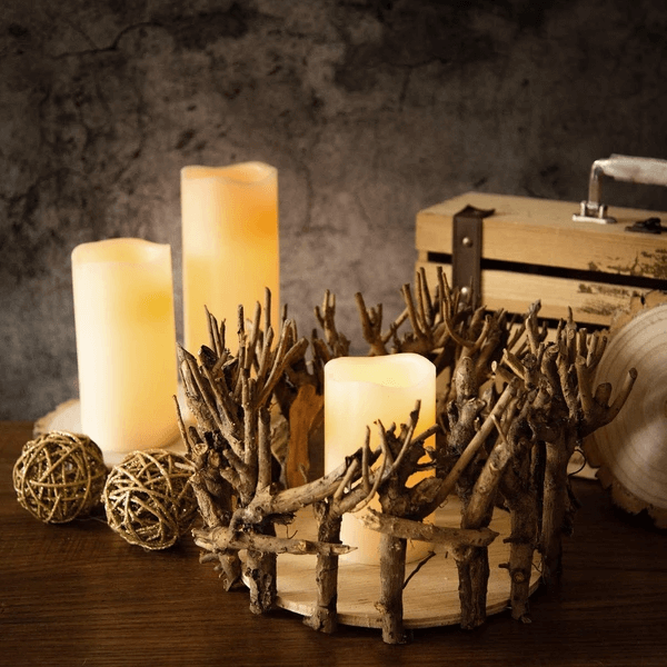 Branch candle holder with pillar candles and gold accents