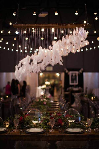 Feather garland over a banquet table
