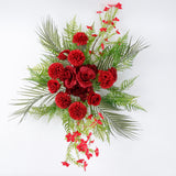 Red floral arrangement with greenery on a white background. #whtbkgd