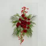 Artificial floral arrangement with red roses and greenery