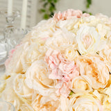 Elegant bouquet of soft pink and cream roses in a lush arrangement.