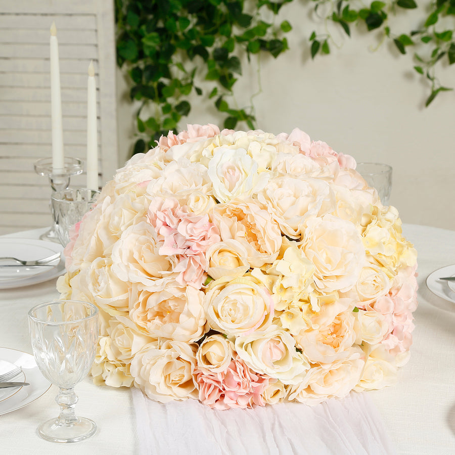Floral centerpiece arrangement in soft pastel colors on a dining table.