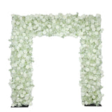 White floral wedding arch with roses and greenery