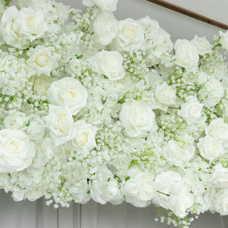 White floral arrangement featuring roses and hydrangeas.
