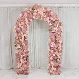 Pink floral wedding arch with roses and hydrangeas against white drapes