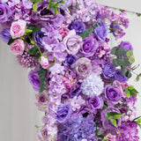 Purple and pink floral wall arrangement with roses and greenery#whtbkgd