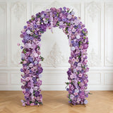 Lavender floral arch with purple roses in elegant white interior