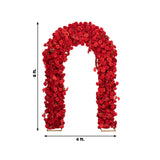 Red floral arch made of roses and mixed flowers on white background
