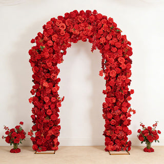 Red floral arch with rose arrangements and bouquets on a white wall background