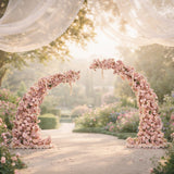 Floral arch arrangement with pink flowers for event decor.