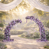 Purple floral arch with cascading blooms, elegantly designed for events. 