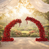 Red floral arch with arrangements, perfect for weddings and events. 