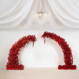 Red floral arch decoration for events and weddings.