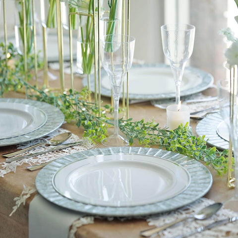 Table setting with glassware and greenery runner