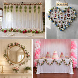 Artificial mini rose garlands draped around a mirror, used as a backdrop, and styled as a table c...