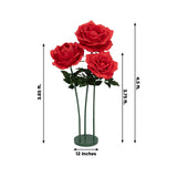 Red artificial roses in a green vase, measuring 4.5 ft tall and 12 in wide.