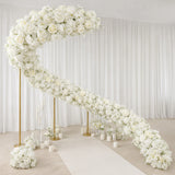 Elegant white floral wedding arch with gold stands and aisle candles