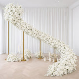 Elegant white floral wedding staircase with gold stands and candles
