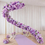 Lavender floral wedding arch with purple blooms and gold stands