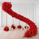 Red rose floral staircase installation in elegant white room