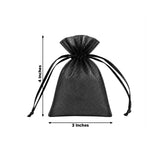 Black sheer organza drawstring pouch with floral backdrop