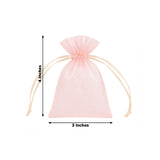 Pink organza drawstring gift bag with white roses on a soft background