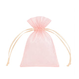 Pink sheer drawstring gift pouch with ribbon ties on white background#whtbkgd