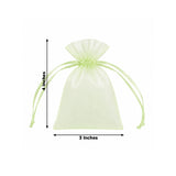 Sheer green organza gift pouch with floral arrangement background