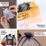 Premium organza gift bags in various colors and sizes, featuring satin ribbon knots.
