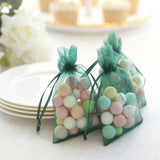 Colorful candy-filled bags for party favors on a table.