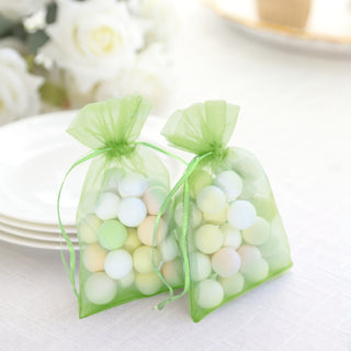 Green organza bags filled with pastel-colored decorative eggs.