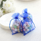 Blue organza bags filled with colorful decorative balls
