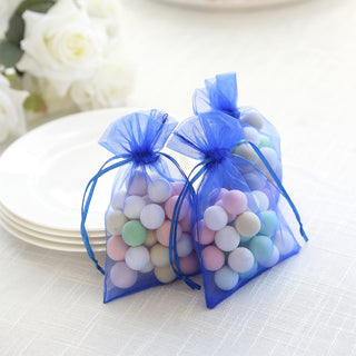 Blue organza bags filled with colorful decorative balls