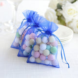 Colorful decorative candy-filled bags in blue organza.