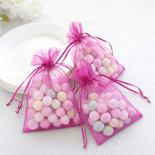 Colorful pastel candy bags in pink organza, perfect for party favors.